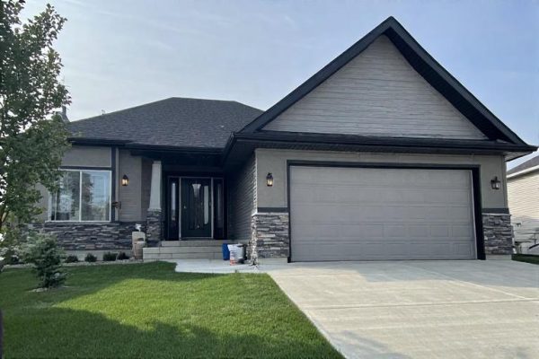 EIFS Stucco Installation & Repair | Depend Exteriors Windermere Edmonton EIFS stucco installation and repair completed by Depend Exteriors in Windermere, Edmonton, showing fresh acrylic finish, decorative moulding, and seamless wall cladding on a residential exterior.