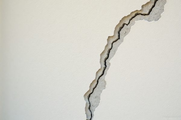 Structural stucco crack exposing EIFS layers