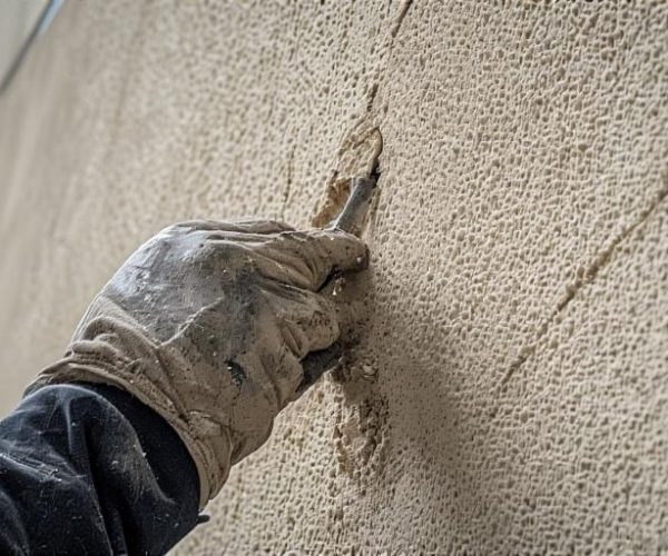 Exterior team applying EIFS layers with mesh and base coats on a Beacon Heights home